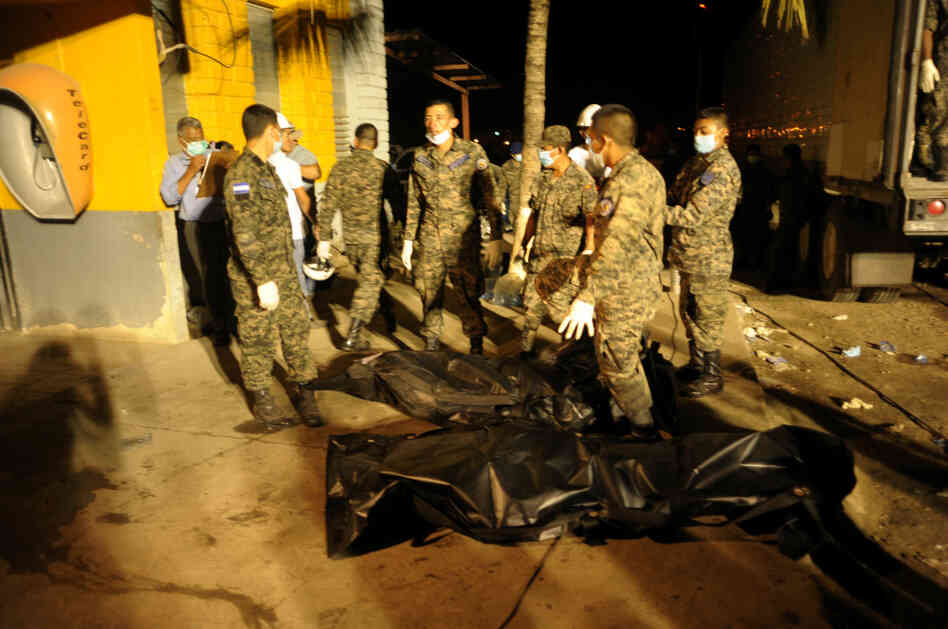 Inmates bodies are loaded in a trailer truck at the National Prison in Comayagua, north of Tegucigalpa.