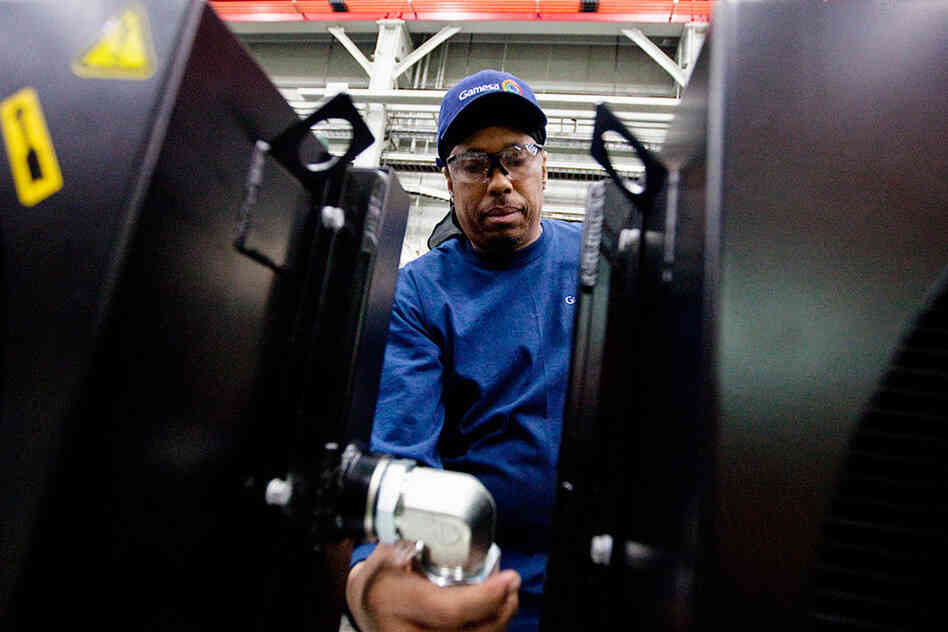 About 175 people work at Gamesa's factory, including Jerry "Jazz" Holt, who is assembling an oil cooler unit.