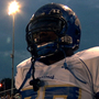 North Memphis' Manassas Tigers Coach Bill Courtney and player O.C. Brown stand on the sidelines in a scene from the Oscar-nominated documentary Undefeated.