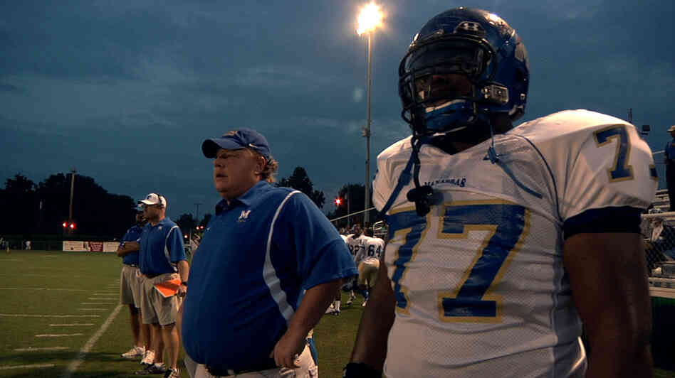 North Memphis' Manassas Tigers Coach Bill Courtney and player O.C. Brown stand on the sidelines in a scene from the Oscar-nominated documentary Undefeated. North Memphis' Manassas Tigers Coach Bill Courtney and player O.C. Brown stand on the sidelines in a scene from the Oscar-nominated documentary Undefeated.