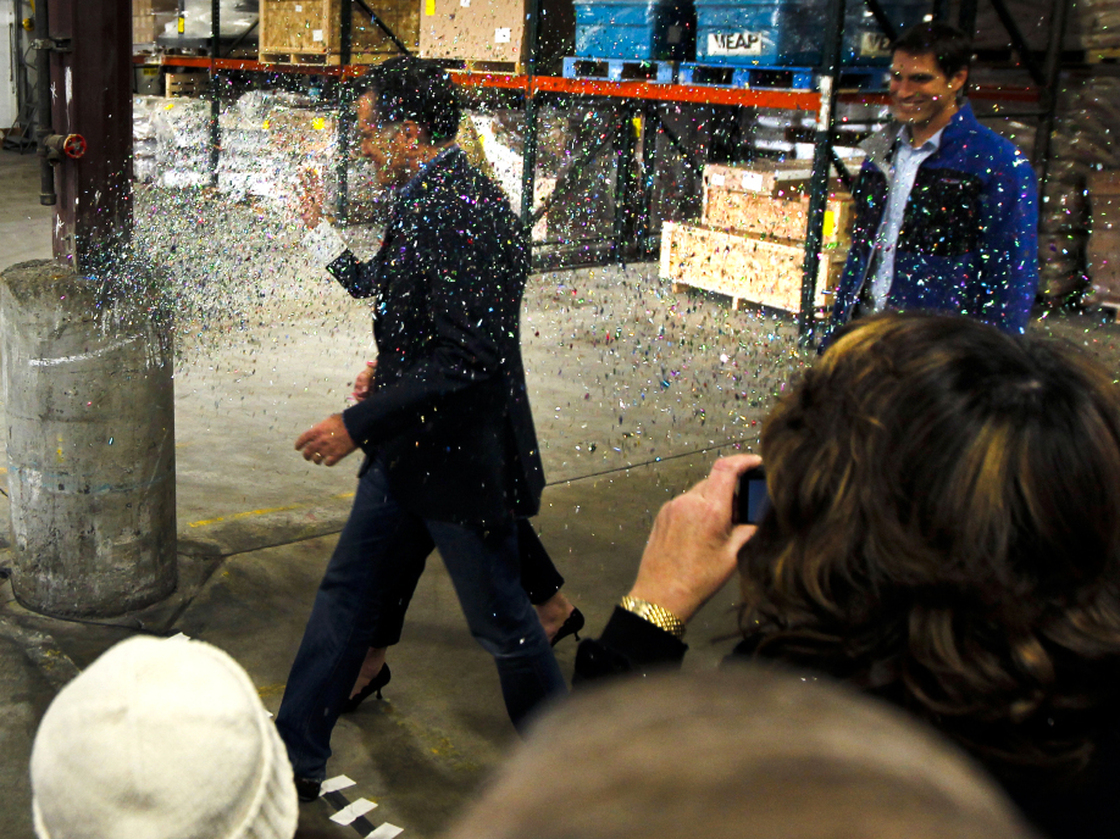 Republican presidential candidate Mitt Romney is glitter-bombed as he walks to the stage at the start of a campaign rally in Eagan, Minn., on Feb. 1.