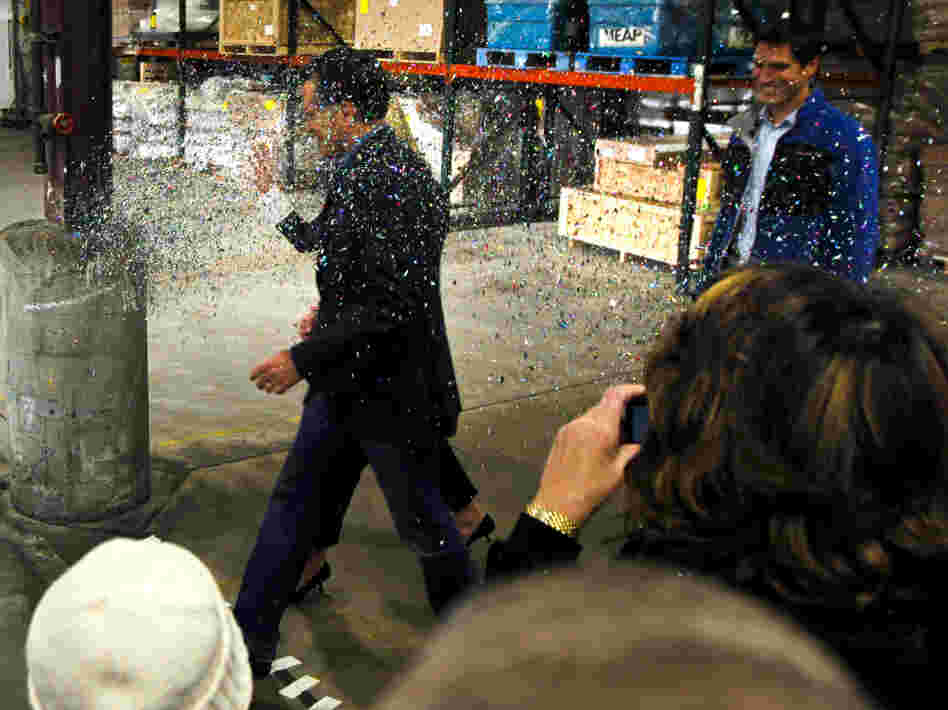 Republican presidential candidate Mitt Romney is glitter-bombed as he walks to the stage at the start of a campaign rally in Eagan, Minn., on Feb. 1.