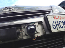 A car camera attached to the front bumper of Google's driverless car. A car camera attached to the front bumper of Google's driverless car.