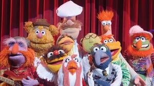 The cast of The Muppets includes (left to right) Floyd Pepper, Fozzie Bear, Lew Zealand, Janice, Swedish Chef, Camilla The Chicken, Dr. Bunsen Honeydew, Gonzo, Scooter and Beaker.