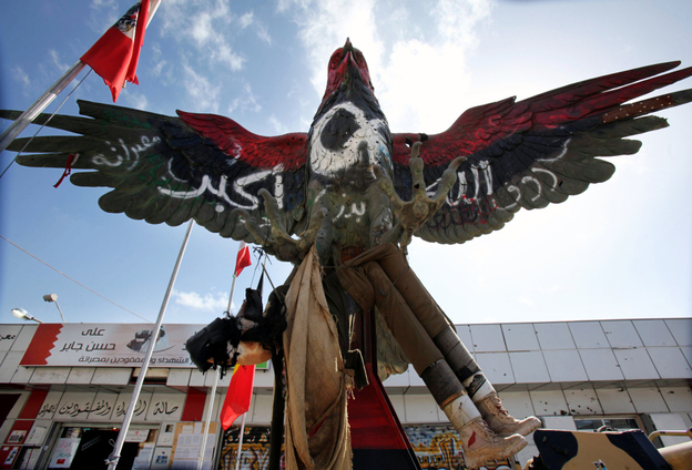 A falcon statue, painted in the colors of the revolutionary flag and covered with the inscription "God is great", and is displayed outside the museum set up on Tripoli boulevard in Misrata on Feb. 12.