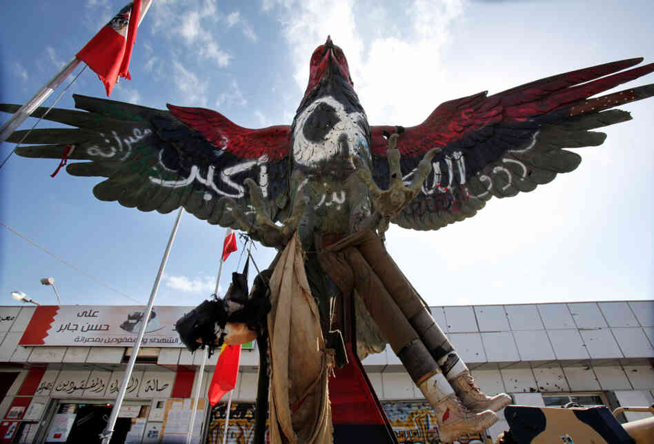 A falcon statue, painted in the colors of the revolutionary flag and covered with the inscription "God is great", and is displayed outside the museum set up on Tripoli boulevard in Misrata on Feb. 12.