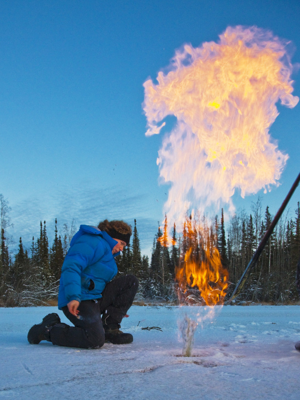 A new program led by the U.S. seeks to limit amounts of soot, hydrofluorocarbons and methane   released into the atmosphere. In this file photo from 2009, a researcher ignites trapped methane from under a pond's ice cap in Alaska.