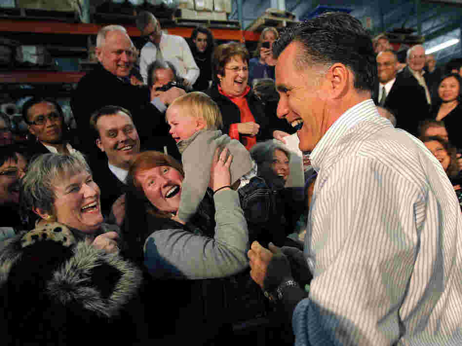 Mitt Romney laughs with supporters at a rally in Kentwood, MI, Wednesday, Feb. 15, 2012.  