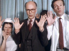 Gambon's character slips in and out of feverish dreams in which his doctors and nurses start to sing and dance. Gambon's character slips in and out of feverish dreams in which his doctors and nurses start to sing and dance.