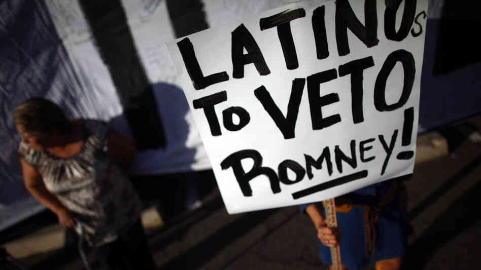 Protesters demonstrate as Republican presidential contender Mitt Romney attends a Get Out the Vote Rally in Mesa, Ariz. Protesters demonstrate as Republican presidential contender Mitt Romney attends a Get Out the Vote Rally in Mesa, Ariz.
