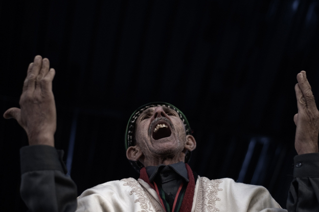 An elderly man shouts religous slogans as Libyans celebrate the 1st anniversary marking the start of the Libyan uprising against Moammar Gadhafi in Freedom Square in the eastern city of Benghazi.