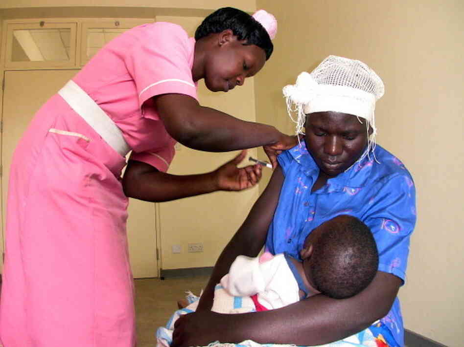 A health worker injects a woman with a shot of Depo Provera, a quarterly contraceptive injection, at a health clinic in Busia, Uganda, in 2009.