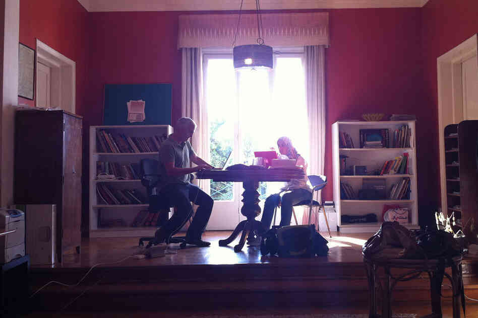 In the Cairo bureau of The New York Times, Shadid (left) files a story on Mubarak's trial on Aug. 3, 2011. 