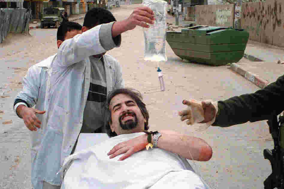 In 2002, while working for the Boston Globe, Shadid was shot in the shoulder while reporting in the West Bank city of Ramallah. 