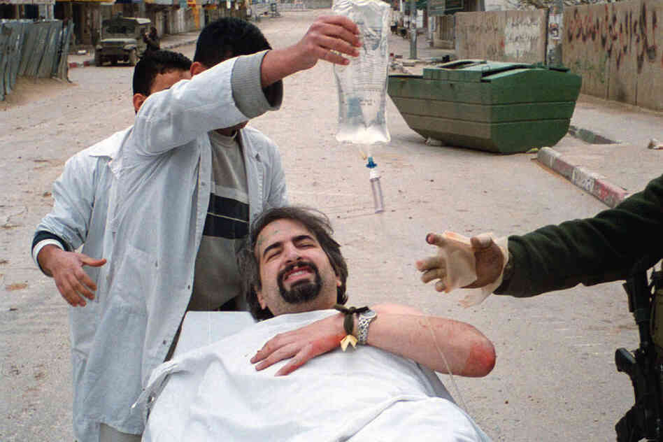 In 2002, while working for the Boston Globe, Shadid was shot in the shoulder while reporting in the West Bank city of Ramallah. 