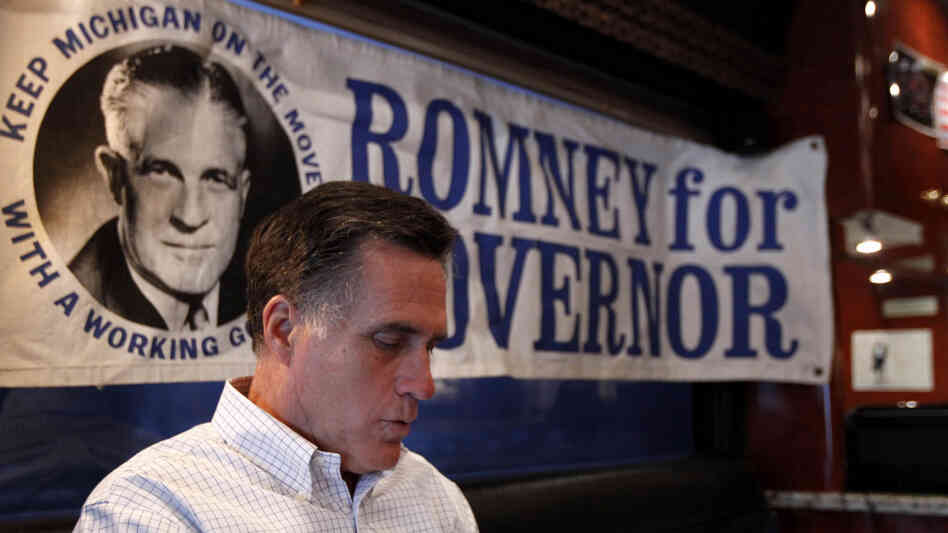 Mitt Romney works Thursday in Michigan aboard his campaign bus, which displays a poster for his late father, former Michigan Gov. George Romney. Despite deep roots in the state, Romney finds himself battling a candidate who has barely visited. Mitt Romney works Thursday in Michigan aboard his campaign bus, which displays a poster for his late father, former Michigan Gov. George Romney. Despite deep roots in the state, Romney finds himself battling a candidate who has barely visited.