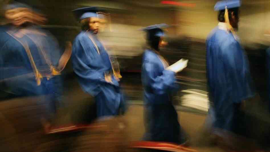 In Cleveland, 2010 GED graduates from the Get On Track program parade down the aisle during their commencement. In today's economy, some experts say, the GED may not be enough to provide "gainful employment." In Cleveland, 2010 GED graduates from the Get On Track program parade down the aisle during their commencement. In today's economy, some experts say, the GED may not be enough to provide "gainful employment."