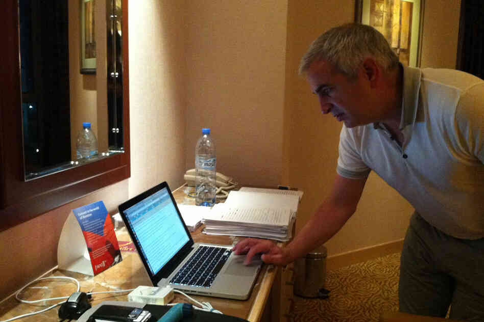 A new book by Shadid, House of Stone, will be published next month. Here, he balances reporting in Manama, Bahrain, with tweaking the manuscript (to his right). 
