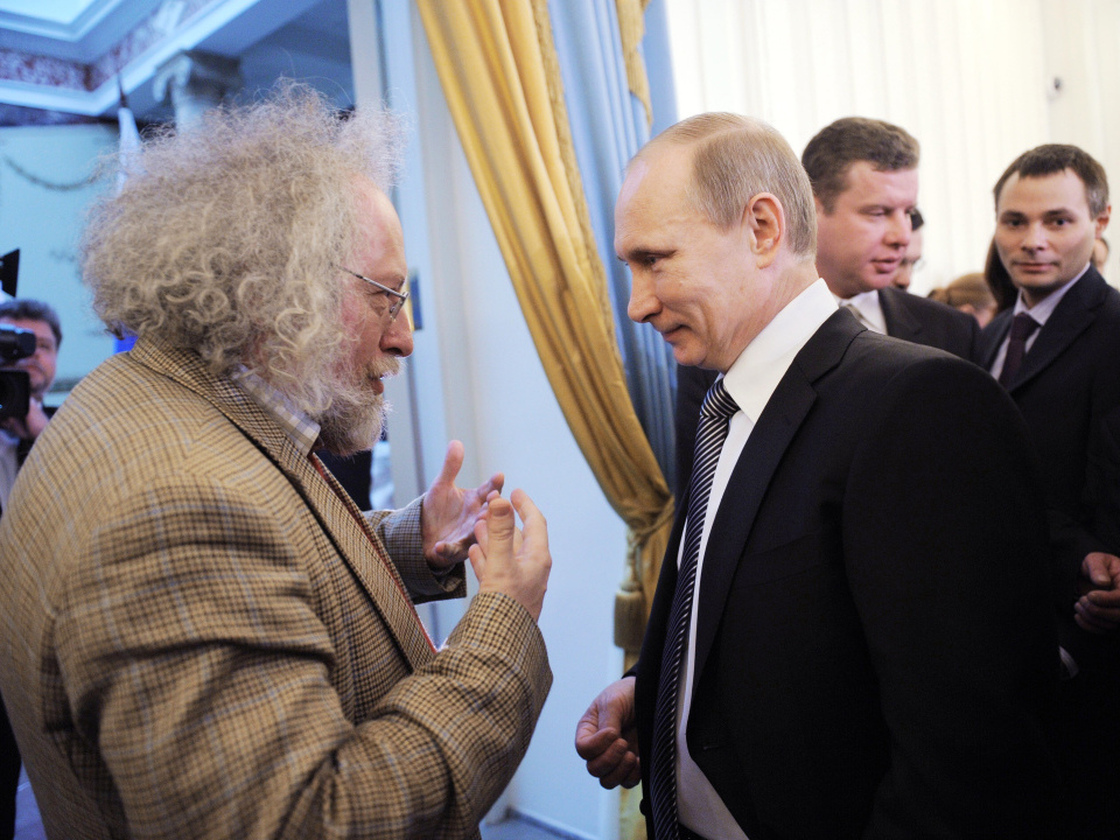 Alexei Venediktov, then editor-in-chief of Moscow Echo radio station, talks with Russian Prime Minister Vladimir Putin during an awards ceremony in Moscow, Jan.  13. Venediktov's ouster this month is seen as a sign that the Russian government may be cracking down on the independent media.