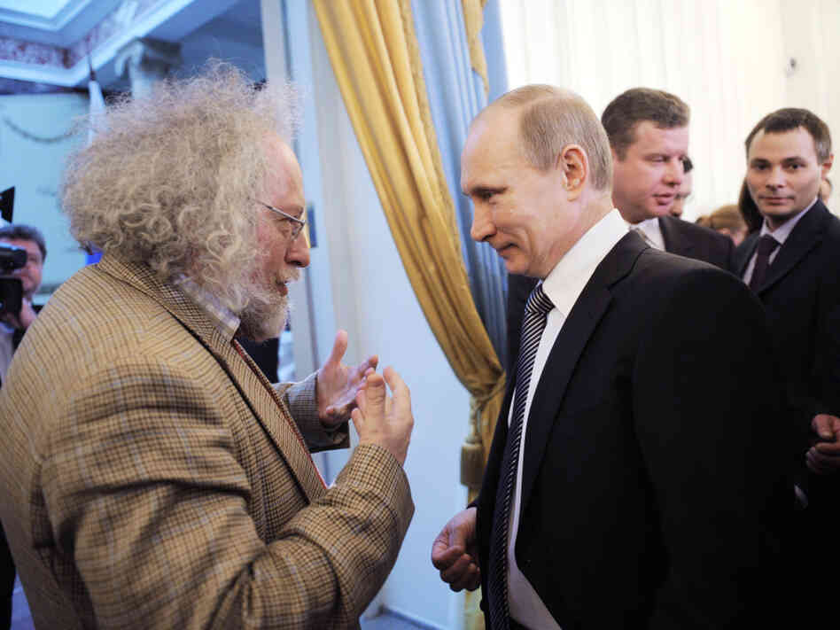 Alexei Venediktov, then editor-in-chief of Moscow Echo radio station, talks with Russian Prime Minister Vladimir Putin during an awards ceremony in Moscow, Jan.  13. Venediktov's ouster this month is seen as a sign that the Russian government may be cracking down on the independent media.