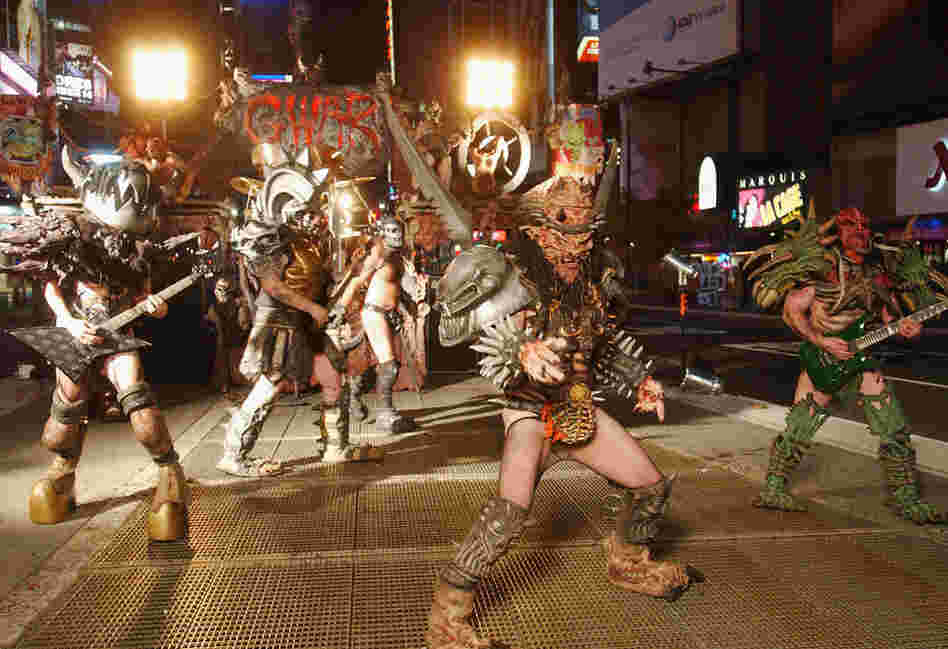 Mask-wearing can blur into full-time theatricality. Legendary heavy metal band GWAR films a video for their new album War Party in Times Square in New York. 
