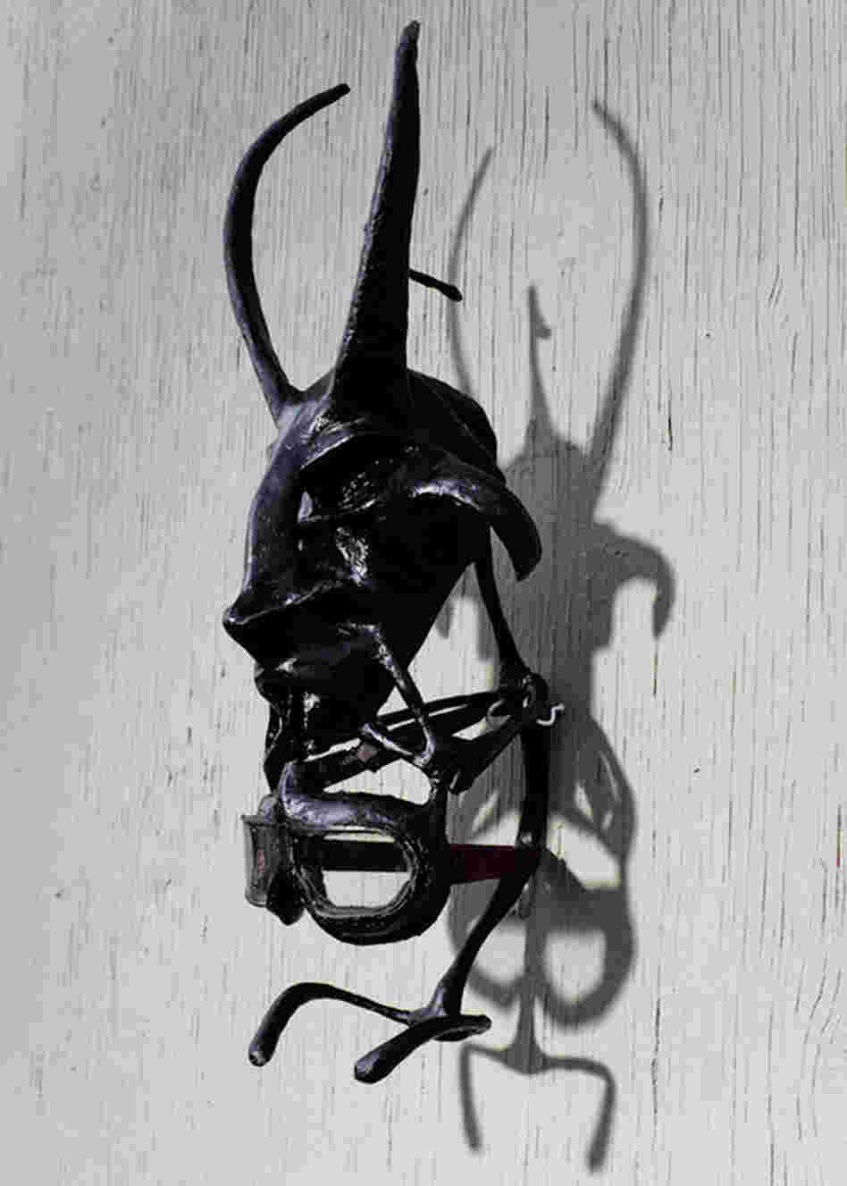 Another mask on Maikoiyo Alley-Barnes' studio wall. "The thing I'm talking about predates language," Alley-Barnes says. "It's primal." 
