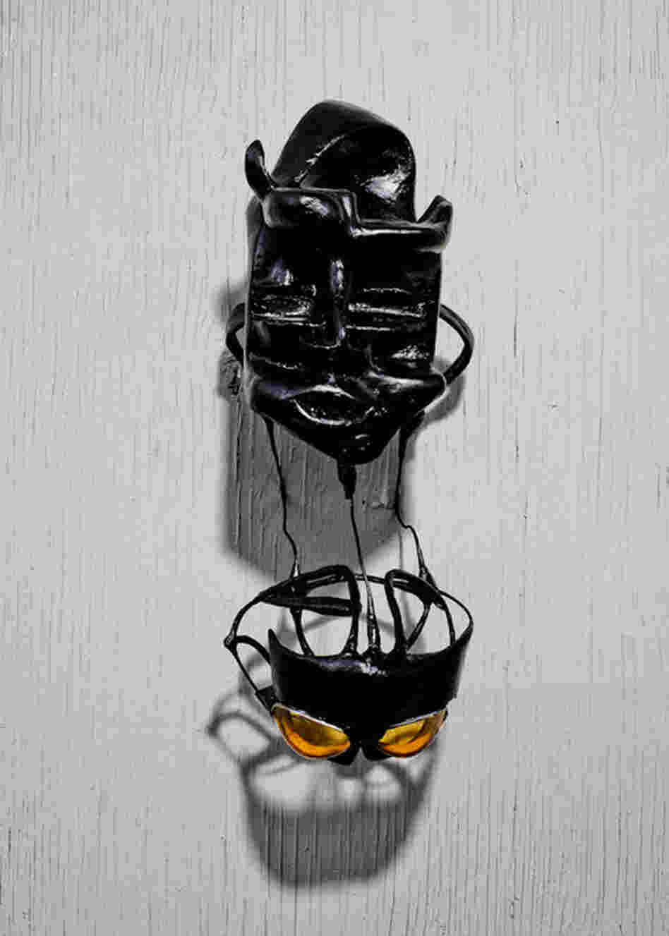 Alley-Barnes' pieces (he prefers to call them headdresses rather than masks) are hand-formed from refuse, wrapped in tape and painted. This one hangs on the wall of his Seattle studio. 