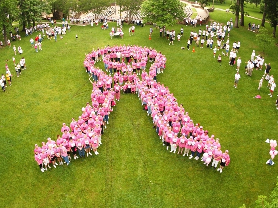  Breast cancer survivors stand to form the shape of a pink ribbon at a Susan G. Komen Foundation charity race in Tyler, Texas, in 2004.