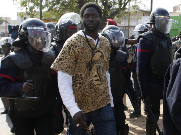 Police arrest Kilifa, a leader of Senegal's rapper-led youth movement, in Dakar on Thursday.