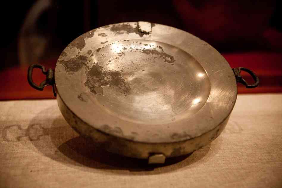 This plate heater was filled with hot water to warm dinnerware.