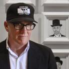 Kurt Wagner in front of some of his paintings.