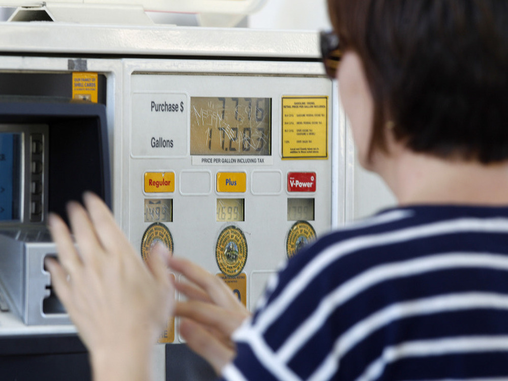 A gas customer views the price on a Shell gas station pump, Tuesday, Feb. 21, 2012 in Del Mar, Calif. 