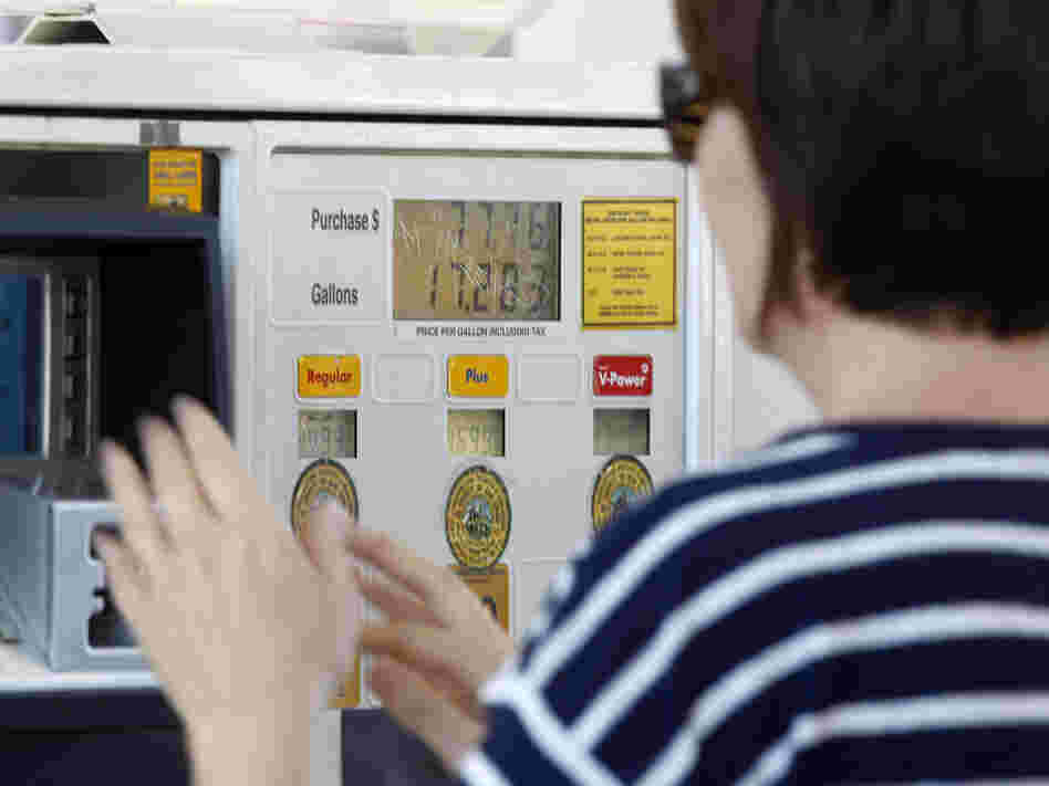 A gas customer views the price on a Shell gas station pump, Tuesday, Feb. 21, 2012 in Del Mar, Calif. 