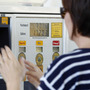 A gas customer views the price on a Shell gas station pump, Tuesday, Feb. 21, 2012 in Del Mar, Calif. 