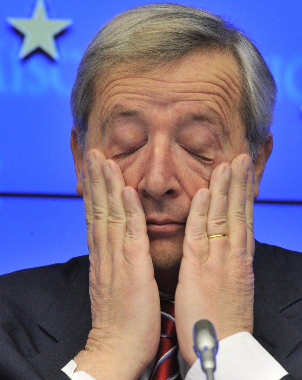 Luxembourg Prime Minister and Eurogroup President Jean-Claude Juncker scratches his eyes during a press conference following the meeting of Eurozone nations earlier today in Brussels. 