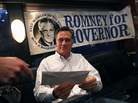 Republican presidential candidate, former Massachusetts Gov. Mitt Romney is handed mail by an aide on his campaign bus between campaign stops in Monroe, Mich., and Farmington Hills, Mich.
