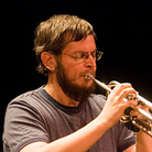 Nate Wooley doesn't play trumpet as much he plays on the trumpet.