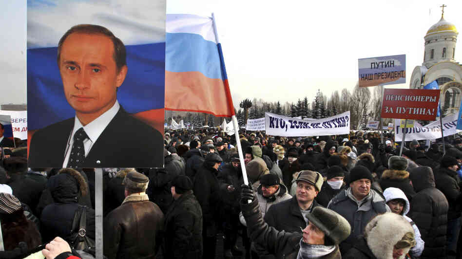 Russians take part in a pro-Putin rally at a Moscow park on Feb. 4. Pro-Kremlin forces have been accused of paying people to attend campaign events ahead of the presidential election in March. Russians take part in a pro-Putin rally at a Moscow park on Feb. 4. Pro-Kremlin forces have been accused of paying people to attend campaign events ahead of the presidential election in March.