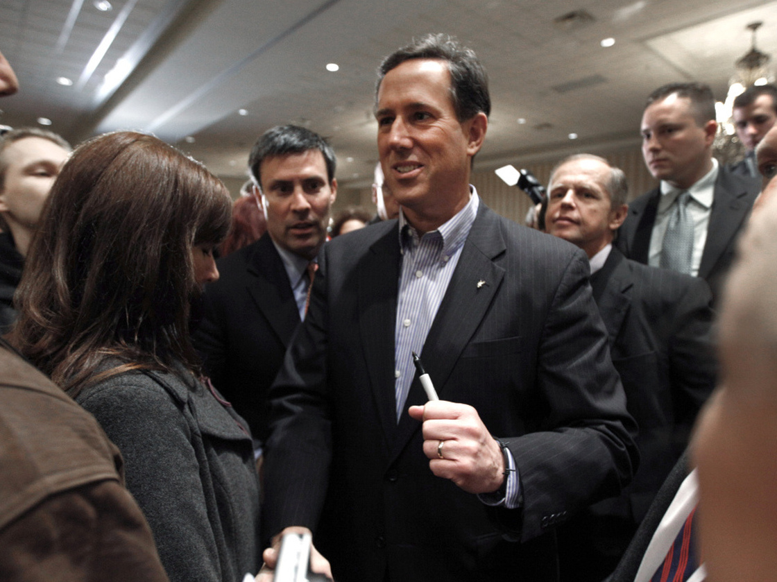 Rick Santorum greets people at the Michigan Faith & Freedom Coalition rally in Shelby Township, Mich., Friday, Feb. 17, 2012. 