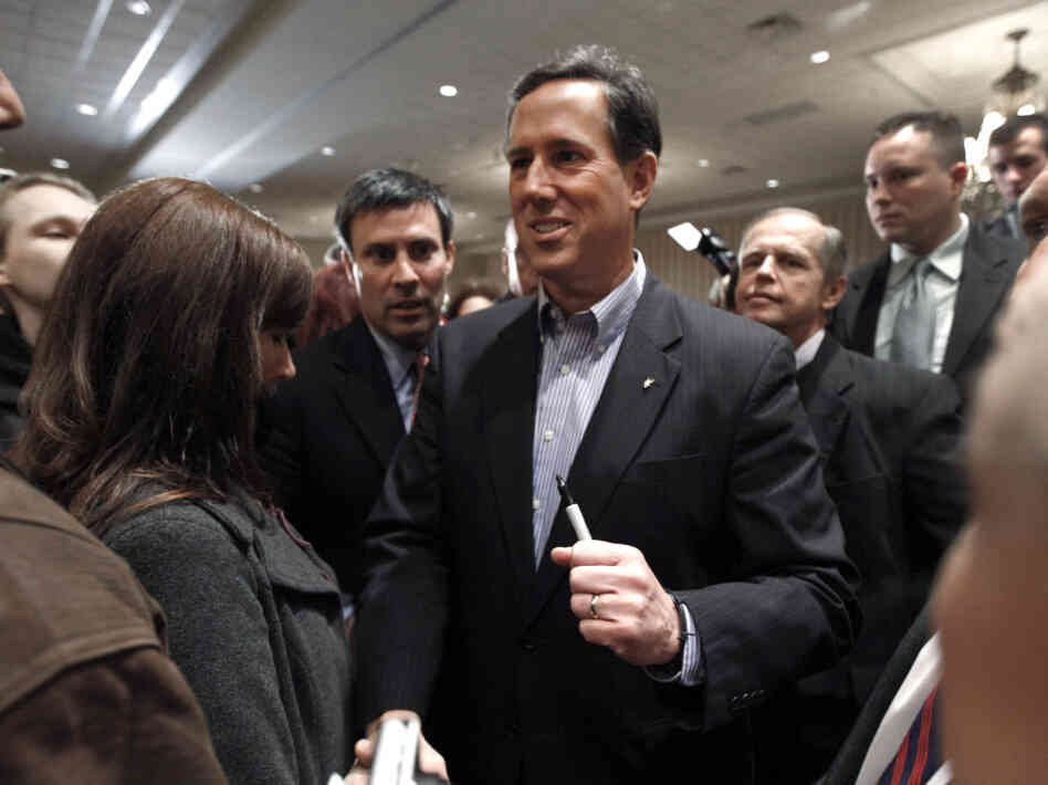 Rick Santorum greets people at the Michigan Faith & Freedom Coalition rally in Shelby Township, Mich., Friday, Feb. 17, 2012. 