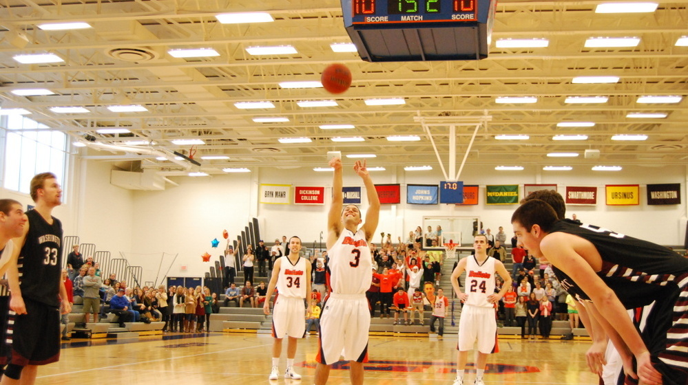 Senior Cory Weissman (center) of Gettysburg College, takes his second free-throw shot in a Division III Centennial Conference game against Washington College.