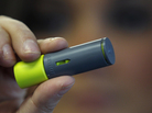 A woman holds an AeroShot inhalable caffeine device in Boston. A woman holds an AeroShot inhalable caffeine device in Boston.