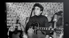 A young George Harrison and his many guitars. A young George Harrison and his many guitars.
