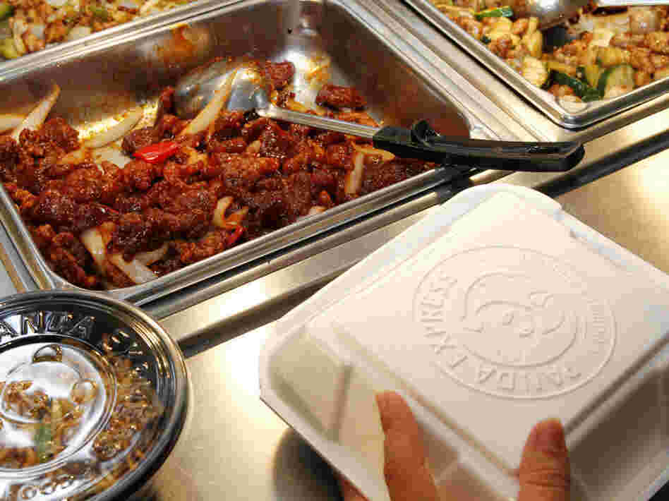 An employee packs a customer's takeout order at a Panda Express restaurant in Los Angeles.