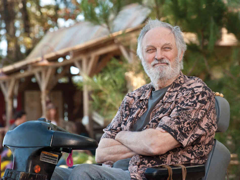 Alan Alda plays Carvin, the founder of the commune, a rural intentional community called Elysium. Alan Alda plays Carvin, the founder of the commune, a rural intentional community called Elysium.