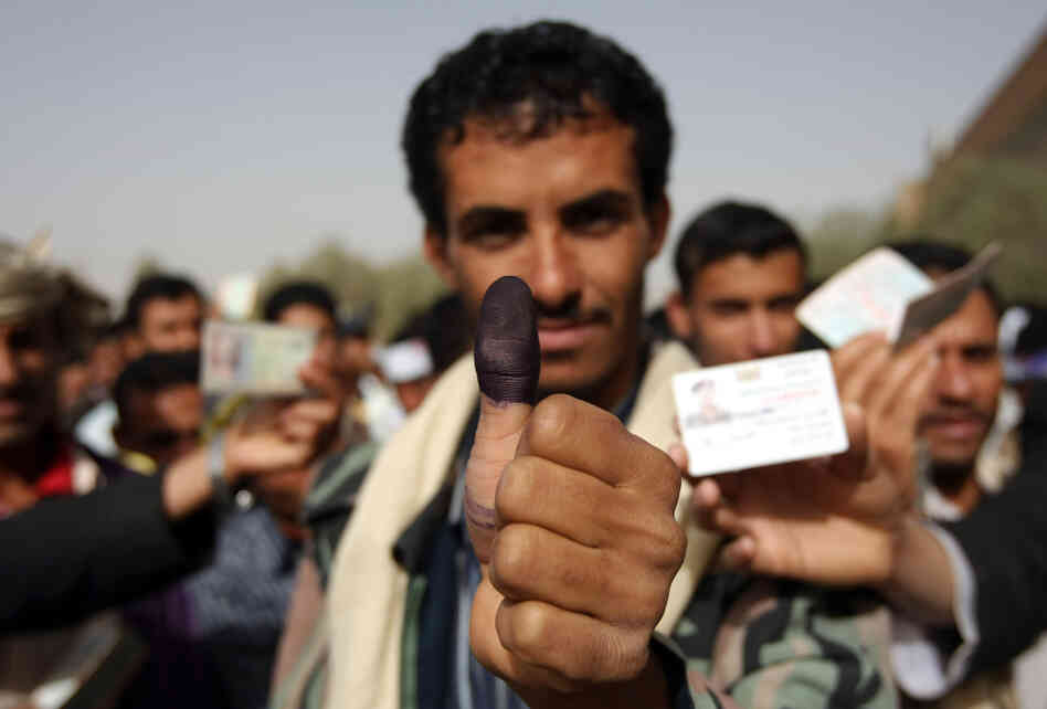 A Yemeni man shows his ink-stained thumb after he voted in the presidential election in Yemen's capital on Feb. 21. The one-candidate election ends President Ali Abdullah Saleh's 33-year hard-line rule. A Yemeni man shows his ink-stained thumb after he voted in the presidential election in Yemen's capital on Feb. 21. The one-candidate election ends President Ali Abdullah Saleh's 33-year hard-line rule.