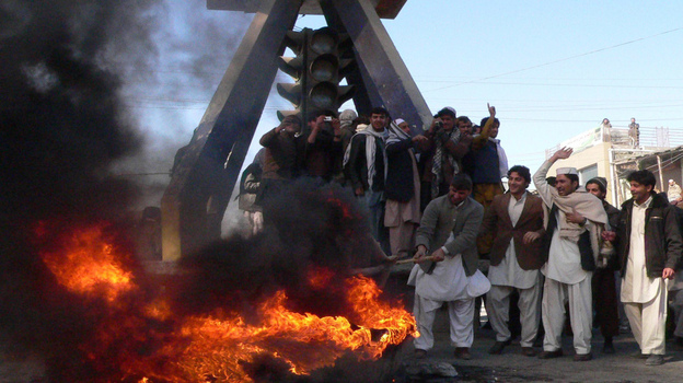 Afghan demonstrators burn an effigy of President Obama and shout anti-U.S. slogans in the eastern city of Jalalabad on Wednesday, Feb. 22. Afghans have been rioting for three days after word that several Qurans were desecrated at a NATO base. The U.S. says the burning of the Qurans was accidental.