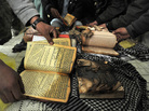 On Feb. 21 outside Bagram Airfield, Afghan demonstrators show copies of Qurans allegedly set on fire by U.S. soldiers at a NATO airbase outside Kabul. On Feb. 21 outside Bagram Airfield, Afghan demonstrators show copies of Qurans allegedly set on fire by U.S. soldiers at a NATO airbase outside Kabul.