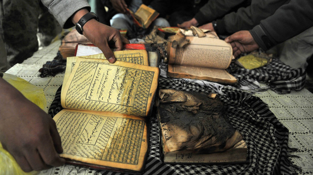 On Feb. 21 outside Bagram Airfield, Afghan demonstrators show copies of Qurans allegedly set on fire by U.S. soldiers at a NATO airbase outside Kabul. On Feb. 21 outside Bagram Airfield, Afghan demonstrators show copies of Qurans allegedly set on fire by U.S. soldiers at a NATO airbase outside Kabul.