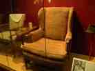Edith and Archie Bunker's chairs on display in the Smithsonian National Museum of American History.